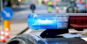 blue flashing police car during a roadblock to hunt down the escaped prisoners